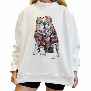A person wearing an oversized off-white sweatshirt with a large painted bulldog graphic on the front, paired with black shorts, against a plain white background.