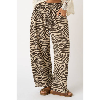 Zebra print pants worn by a person on a white background