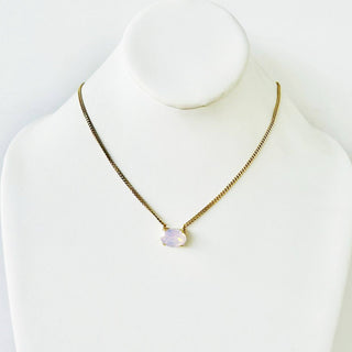 Necklace with a pendant on a mannequin against a white background