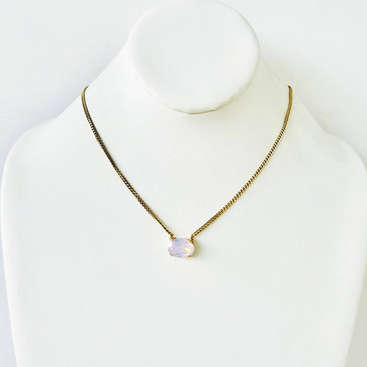 Necklace with a pendant on a mannequin against a white background