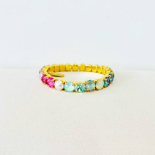 Multicolored beaded bracelet on a light gray background
