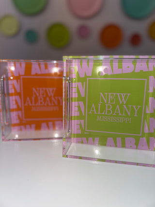 Two clear acrylic trays with 'New Albany, Mississippi' text on a colorful dot background.