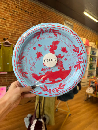Blue and red dinner sized paper plates with colonel Reb printed on them 