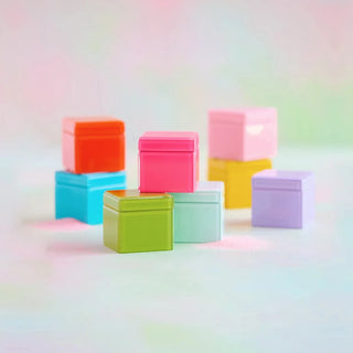 A collection of colorful glass boxes in assorted vivid colors, each measuring 3.75 inches.