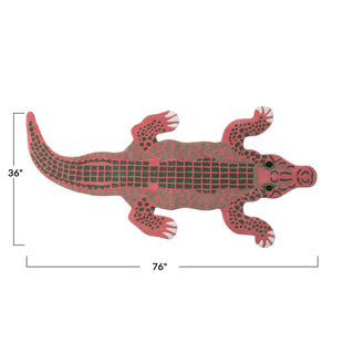 Red alligator-shaped rug with measurements on a white background
