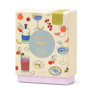 Cocktail-themed playing cards packaging with illustrations of drinks and fruits on a white background.