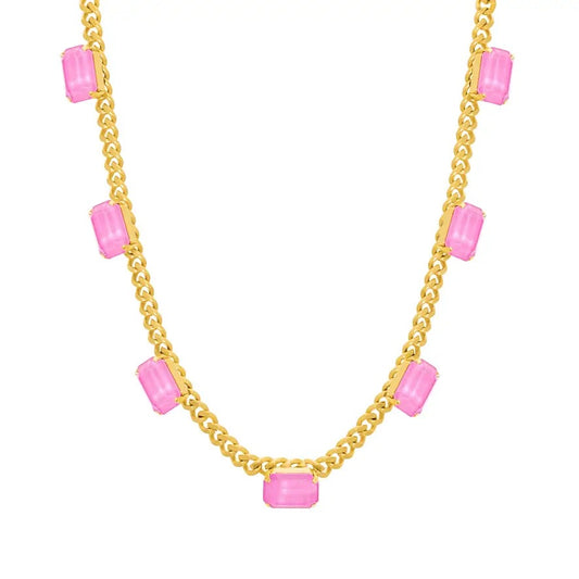 A gold chain necklace featuring multiple rectangular pink gemstone accents spaced along the chain, shown against a plain white background.