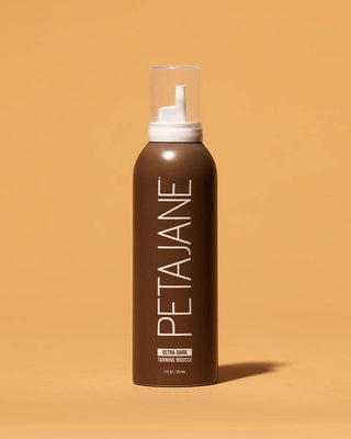 Brown mousse bottle with white cap labeled 'PETAJANE' on a beige background