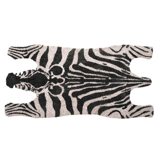 Zebra-patterned rug with a black and white design on a white background