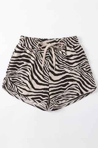 Zebra print shorts with a drawstring on a white background