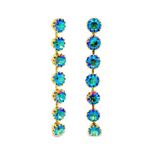 Pair of gold earrings with blue gemstones on a white background