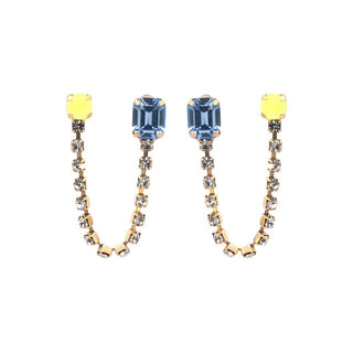 Pair of earrings with blue and yellow gemstones on a white background