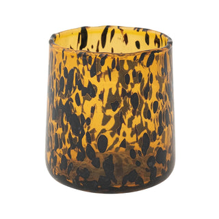 Tortoiseshell patterned glass candle holder on a white background